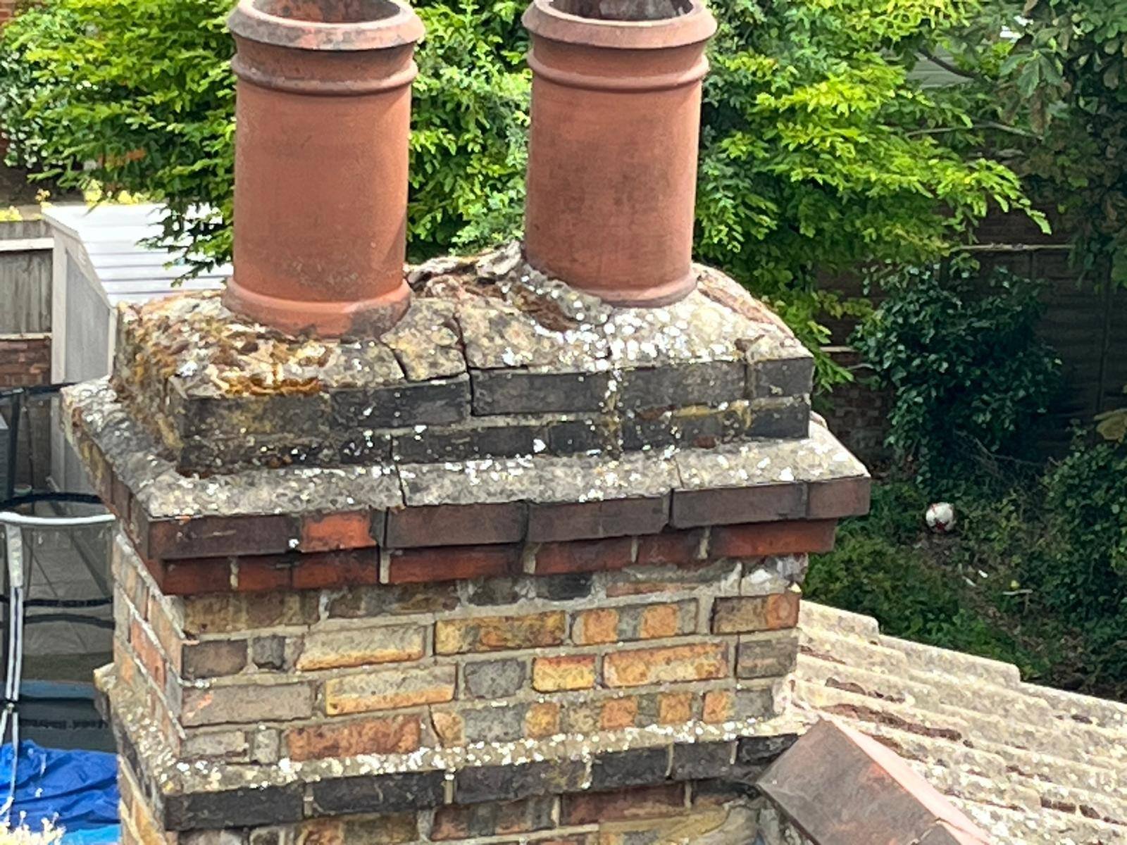 Weathered brick chimney stack being repointed and repaired by Kestrel Property Solutions roofers in High Wycombe, Buckinghamshire